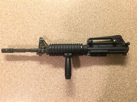 You may wish to purchase a full M4 RAS to mount all your attachments and add a grip at the same time. . Kac m4 ras surplus